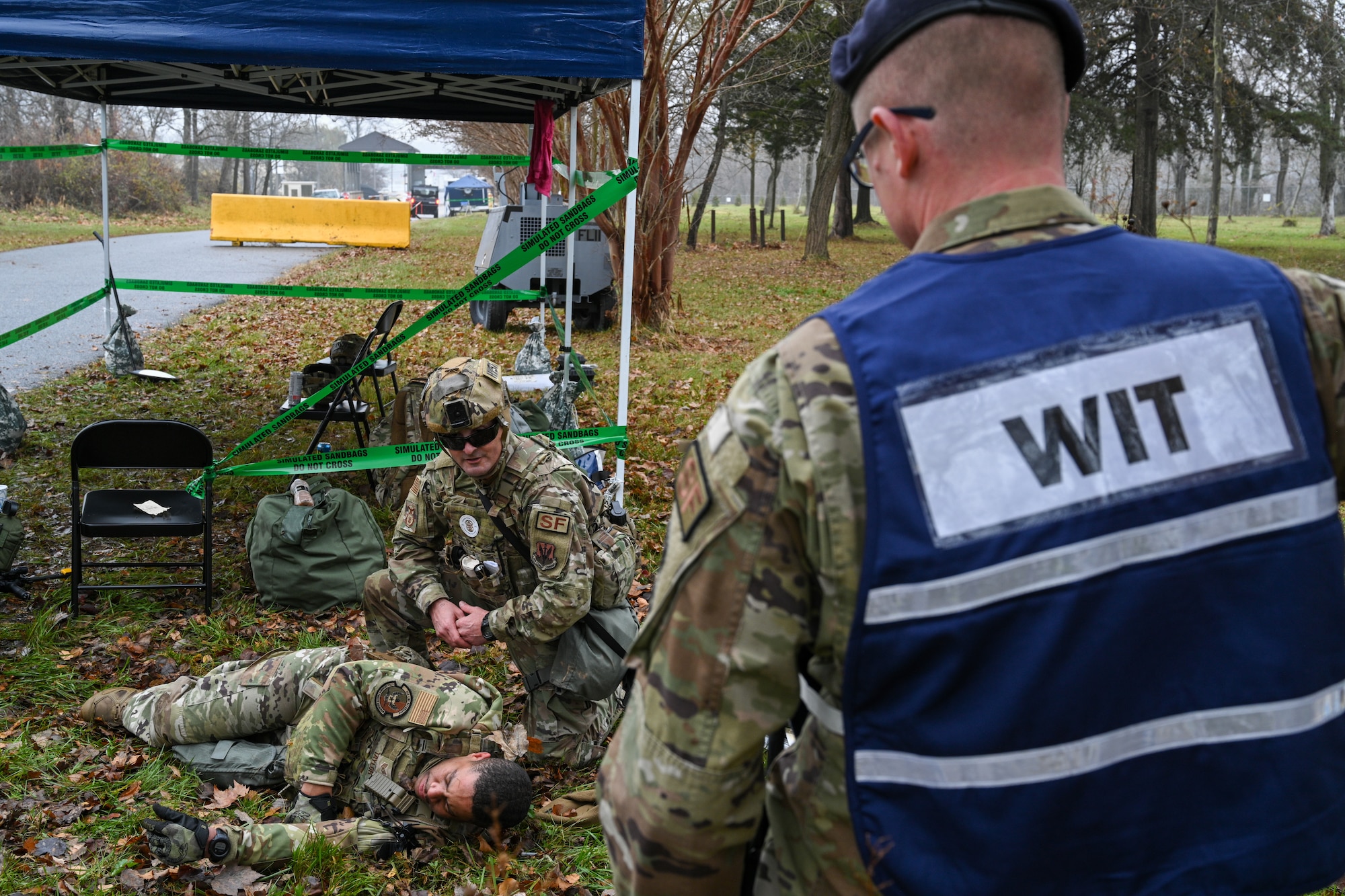Maryland Air National Guard Staff Sgt. William Taylor, 175th Security Forces Squadron, checks on a simulated casualty during Operation Frosty Strike at Martin State Air National Guard Base, Middle River, Maryland, Dec. 2, 2023.