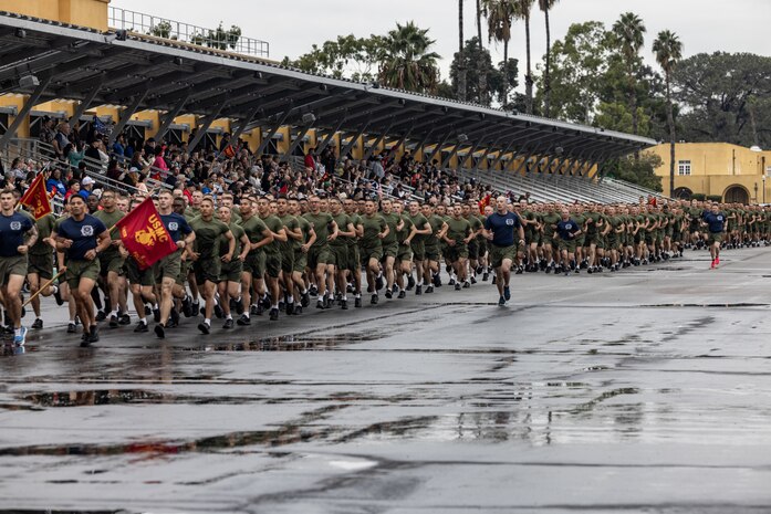 U.S. Marines with Kilo Company, 3rd Recruit Training Battalion, conduct a motivational run at Marine Corps Recruit Depot San Diego, Nov. 30, 2023. The motivational run signifies the last physical fitness event conducted in recruit training. (U.S. Marine Corps photo by Sgt. Jesse K. Carter-Powell)