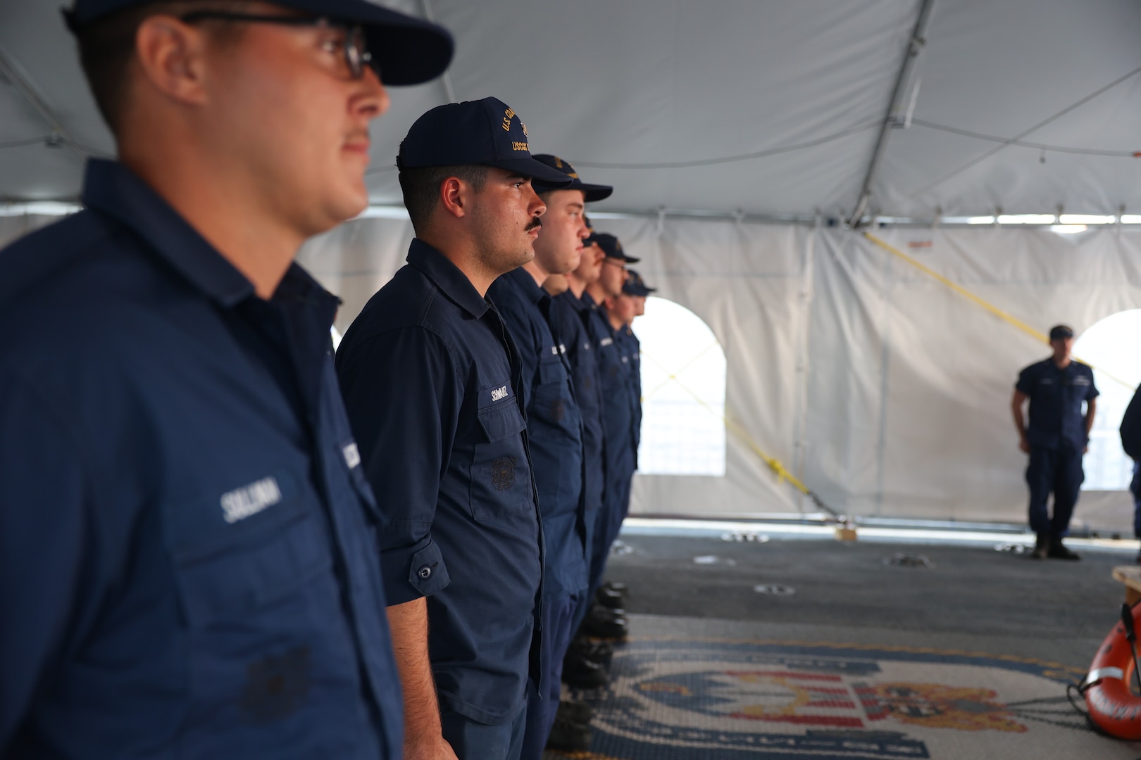 The crew of the U.S. Coast Guard Cutter Tahoma (WMEC 908) holds a permanent cutterman ceremony in the Florida Straits on Oct. 18, 2023. Tahoma deployed for a 65-day patrol and conducted maritime safety and security missions while supporting Homeland Security Task Force – Southeast.