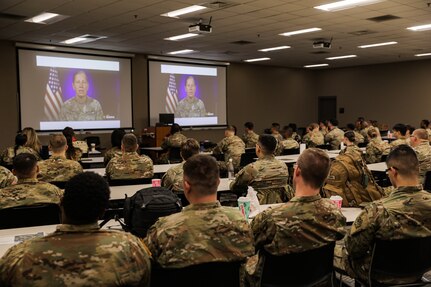 Retired U.S. Army Col. John McCarthy speaks as spouse of U.S. Army Reserve commander