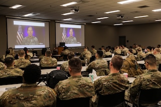 Retired U.S. Army Col. John McCarthy speaks as spouse of U.S. Army Reserve commander