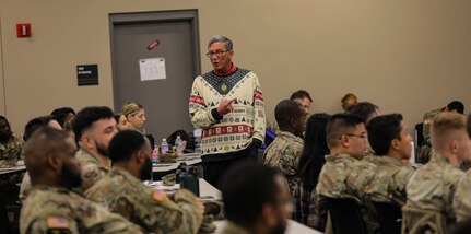 Retired U.S. Army Col. John McCarthy speaks as spouse of U.S. Army Reserve commander