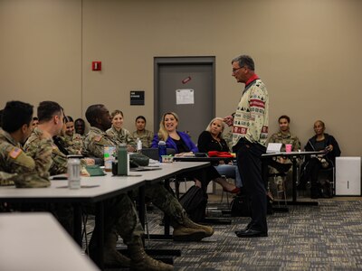 Retired U.S. Army Col. John McCarthy speaks as spouse of U.S. Army Reserve commander