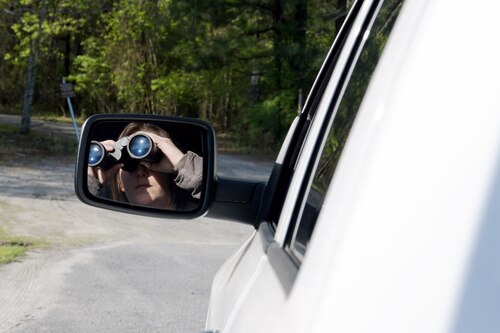 Woman looking through binoculars