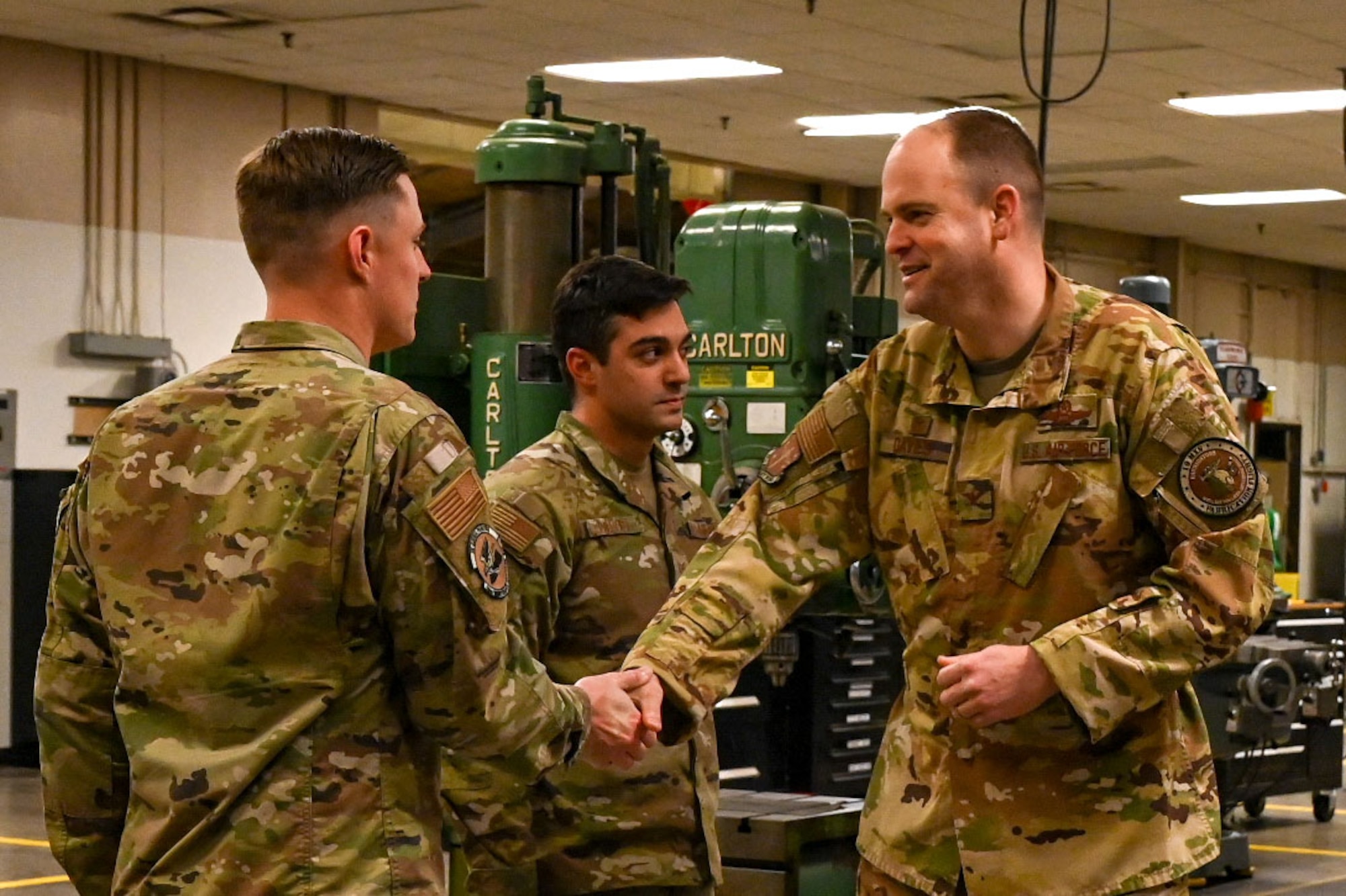 An Airman is presented a coin.