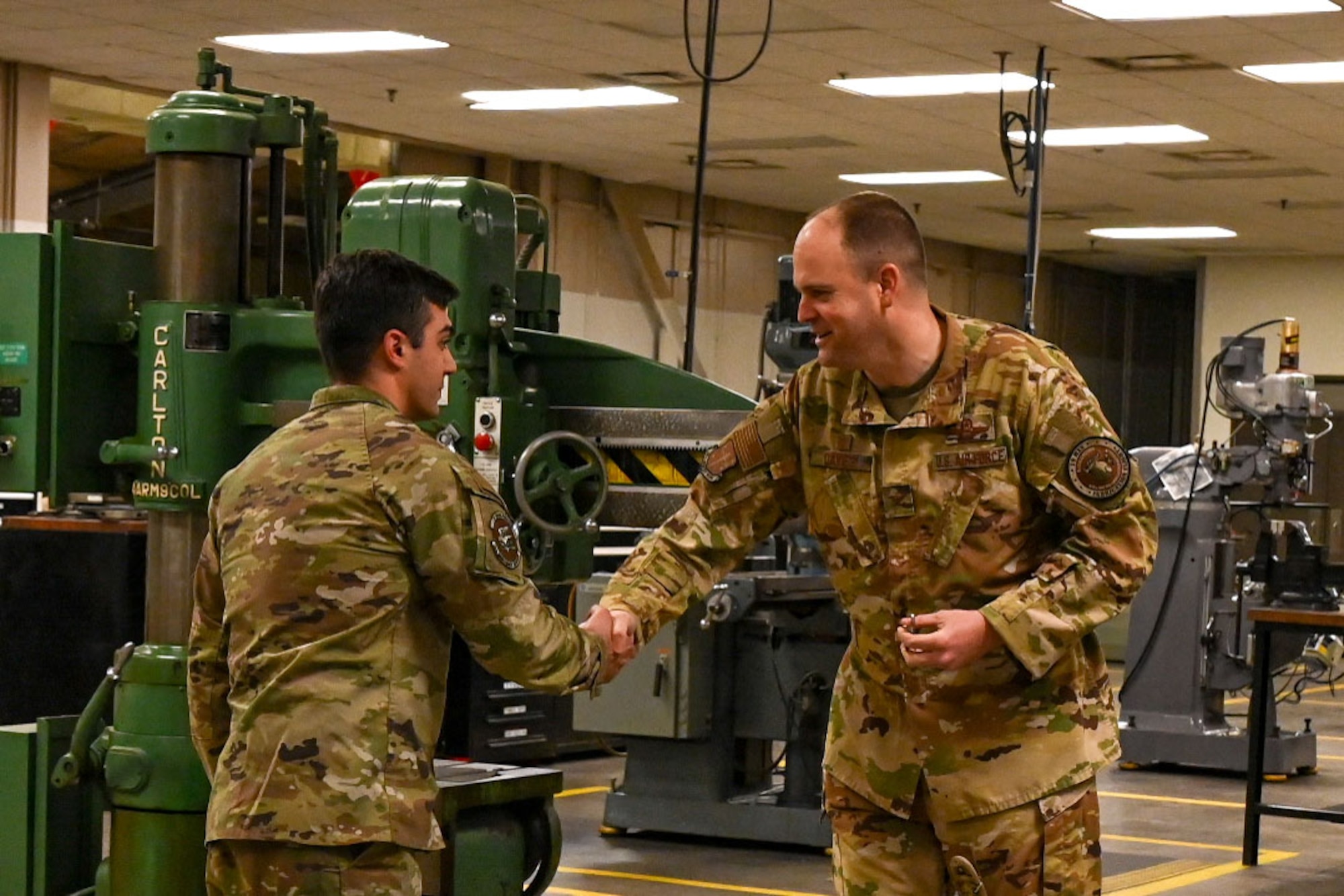 An Airman is presented a coin.