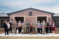 Installation leadership prepares to cut the ribbon at the temporary lodging facility grand opening on Joint Base Charleston, South Carolina.