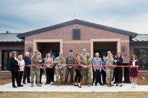 Installation leadership prepares to cut the ribbon at the temporary lodging facility grand opening on Joint Base Charleston, South Carolina.