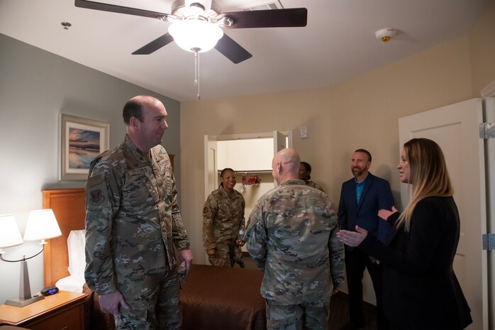 U.S. Air Force Col. Michael  Freeman, 628th Air Base Wing commander, takes a tour of the new temporary lodging facility on Joint Base Charleston, South Carolina.