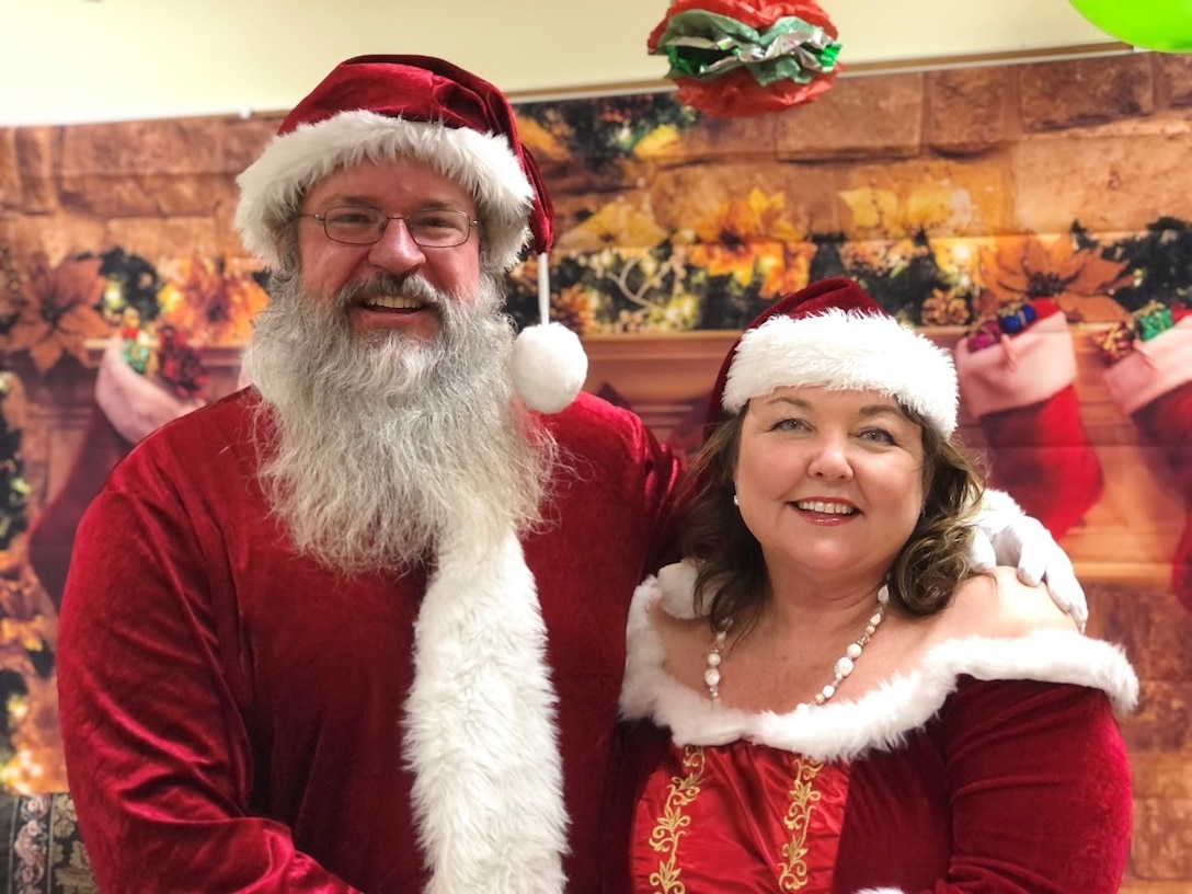 David Quebedeaux, a park ranger at J. Strom Thurmond Lake with the U.S. Army Corps of Engineers, Savannah District, and his wife, Jenny, dress as Santa and Mrs. Claus for a holiday event. The couple say they enjoy helping others and spreading joy.