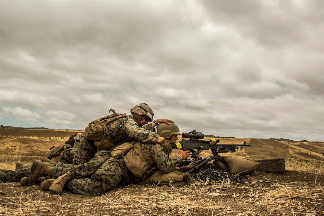 U.S. Marines attending Marine Combat Training (MCT) fire an M240B machine gun at the Marine Corps School of Infantry-West, Camp Pendleton, Calif., May 18, 2018. MCT gives Marines with Military Occupational Specialties other than Infantry (03xx) a basic understanding of the Marine Corps' warfighting ethos, core values, basic tenets of maneuver warfare, leadership responsibilities, mental, moral, and physical resiliency in order to contribute to the successful accomplishment of their unit's mission. (U.S. Marine Corps photo by Cpl. Hailey D. Clay)