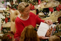 Caral Spangler, Assistant Secretary of the Army for Financial Management and Comptroller, reads a special holiday poem focused on the Army Finance Corps to three children from the U.S. Army Futures Command in Austin, Texas, Nov. 30, 2023. For the last several years, the Office of the ASA (FM&C), the U.S. Army Financial Management Command, and the U.S. Army Finance and Comptroller School partnered together to create a special holiday video for U.S. Army Soldiers, civilian employees and their families. (U.S. Army photo by Mark R. W. Orders-Woempner)