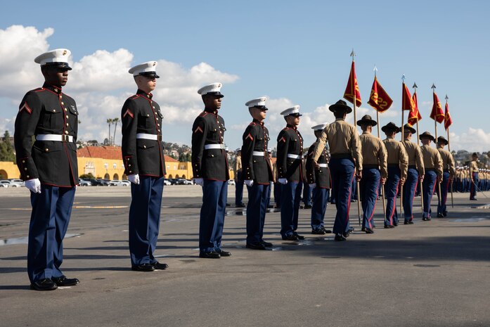 U.S. Marine Corps drill instructors with Kilo Company, 3rd Recruit Training Battalion, retire the guidons during a graduation ceremony at Marine Corps Recruit Depot San Diego, Dec. 1, 2023. Graduation took place at the completion of the 13-week transformation, which included training for drill, marksmanship, basic combat skills, and Marine Corps customs and traditions. (U.S. Marine Corps Photo by Lance Cpl. Sarah M. Grawcock)