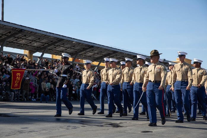 U.S. Marines with Kilo Company, 3rd Recruit Training Battalion, march in formation during their graduation ceremony at Marine Corps Recruit Depot San Diego, Dec. 1, 2023. Graduation took place at the completion of the 13-week transformation, which included training for drill, marksmanship, basic combat skills, and Marine Corps customs and traditions. (U.S. Marine Corps photo by Lance Cpl. Sarah M. Grawcock)