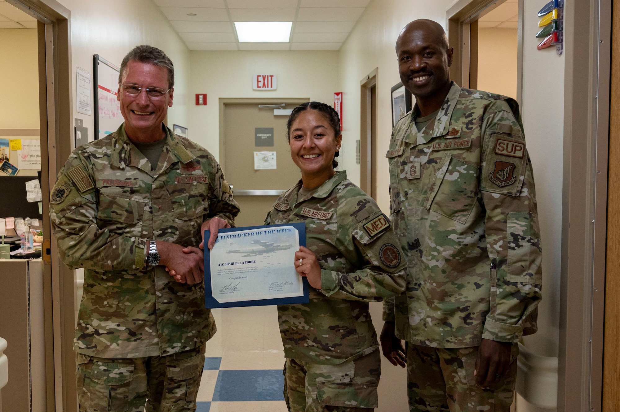 Photo of an Airman receiving the Linebacker of the Week award