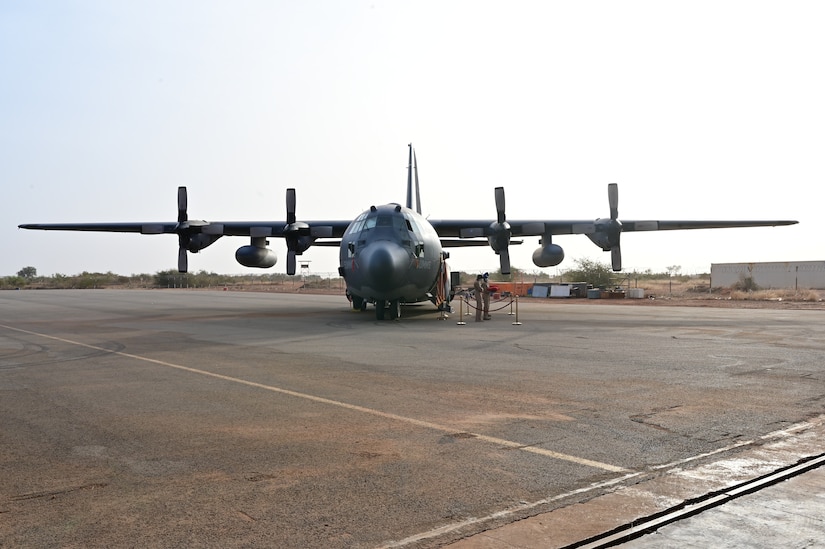 An aircraft sits on a runway.