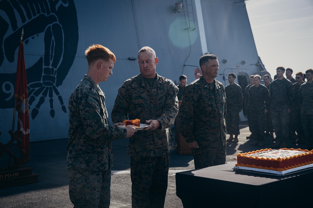 U.S. Marine Corps Lance Cpl. Austin Bradley, a motor transport operator assigned to Combat Logistics Battalion 22, 26th Marine Expeditionary Unit (Special Operations Capable), receives a piece of cake from Gunnery Sgt. Jeremy Meierotto, during a cake cutting ceremony celebrating the Marine Corps Birthday aboard the San Antonio-class amphibious transport dock ship USS Mesa Verde (LPD 19), Mediterranean Sea, Nov. 10, 2023. A key ritual of the cake-cutting ceremony is the passing of the cake from the oldest Marine present to the youngest, symbolizing generations of knowledge being shared to the future of the Corps, and the youngest Marine in the event was Bradley, at 19 years old.

The USS Mesa Verde, assigned to the Bataan Amphibious Ready Group and embarked 26th Marine Expeditionary Unit (Special Operations Capable) under the command and control of Task Force 61/2, is on a scheduled deployment in the U.S. Naval Forces Europe area of operations, employed by U.S. Sixth Fleet to defend U.S., Allied, and partner interests. (U.S. Marine Corps photo by Cpl. Aziza Kamuhanda)