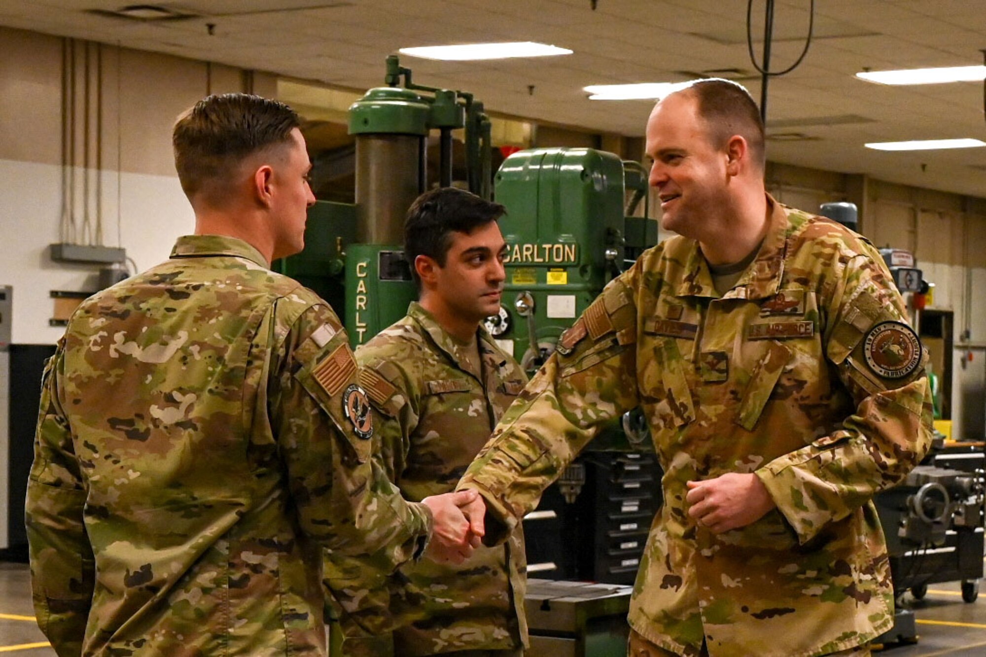 An Airman is presented a coin.