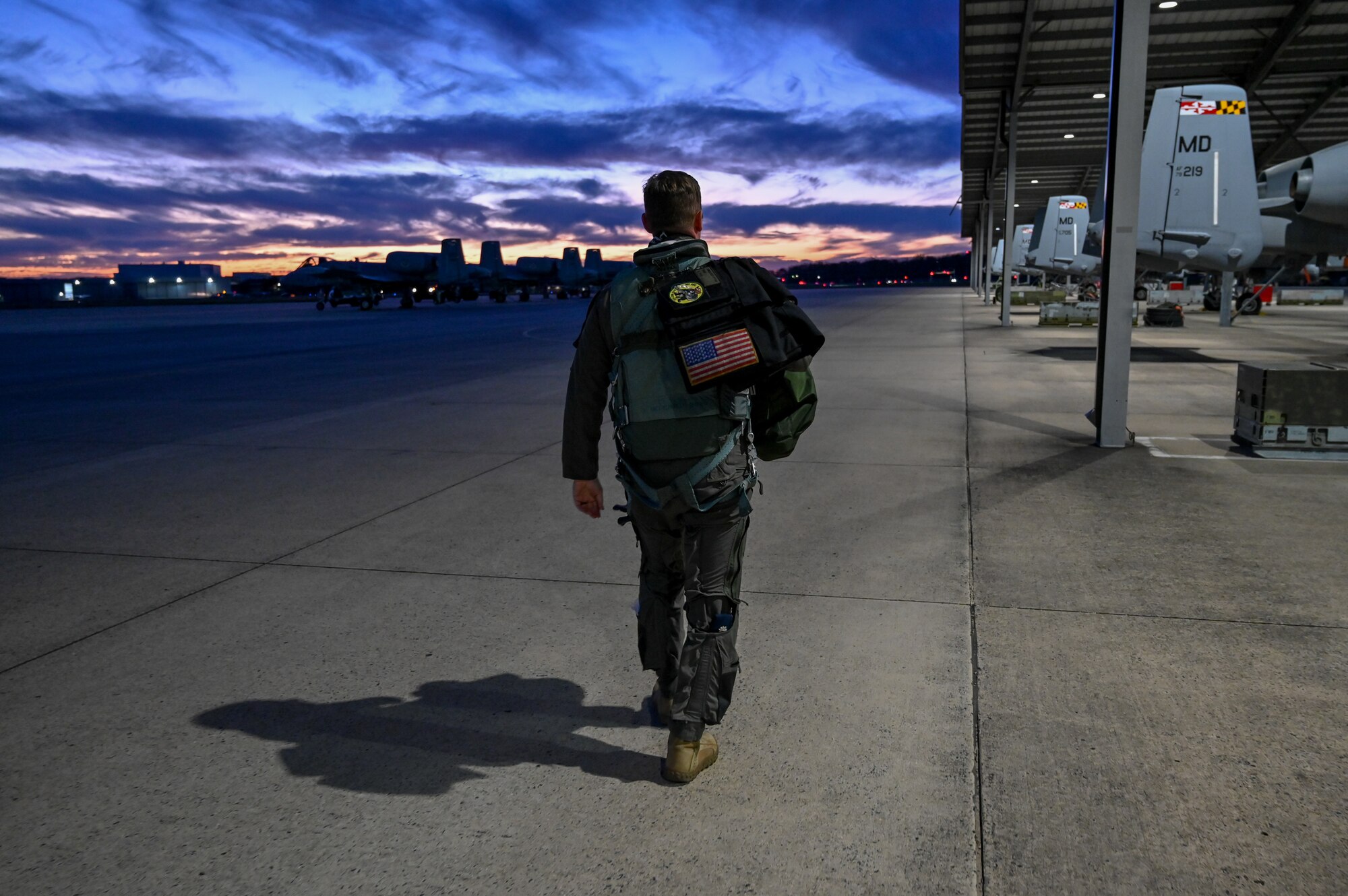 A pilot assigned to the 104th Fighter Squadron prepares to conduct a night flying mission as part of Operation Frosty Strike Nov. 30, 2023, at Martin State Air National Guard Base, Middle River, Md.
