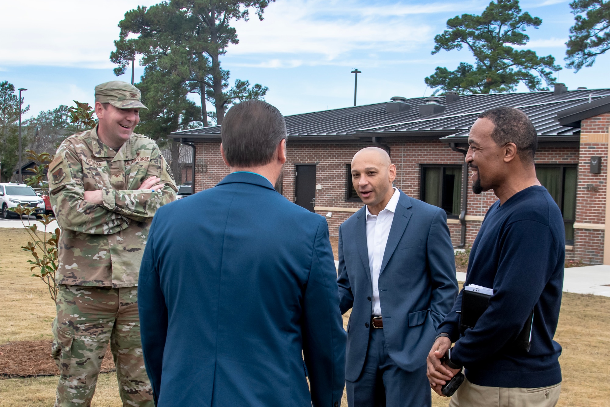 U.S. Air Force Col. Michael Freeman, 628th Air Base Wing commander, visits with guests during the temporary lodging facility grand opening on Joint Base Charleston, South Carolina.