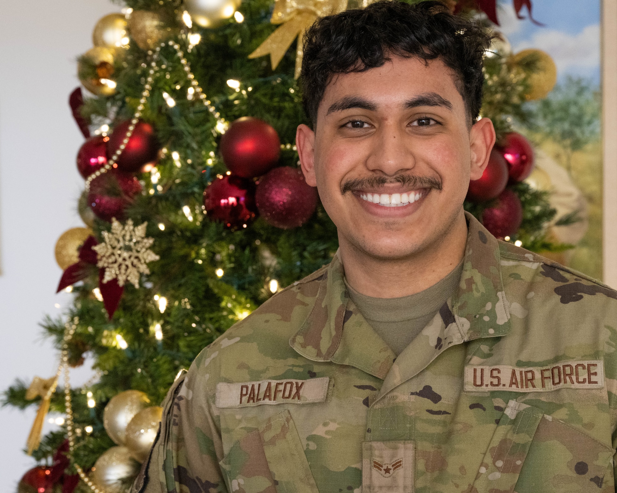 Airman 1st Class Giovanni Palafox, 91st Missile Maintenance Squadron missile maintainer, poses for a portrait at Minot Air Force Base, North Dakota, Dec. 5, 2023. Palafox was the recipient of a free airline ticket through Operation Home for the Holidays. (U.S. Air Force photo by Airman 1st Class Kyle Wilson)