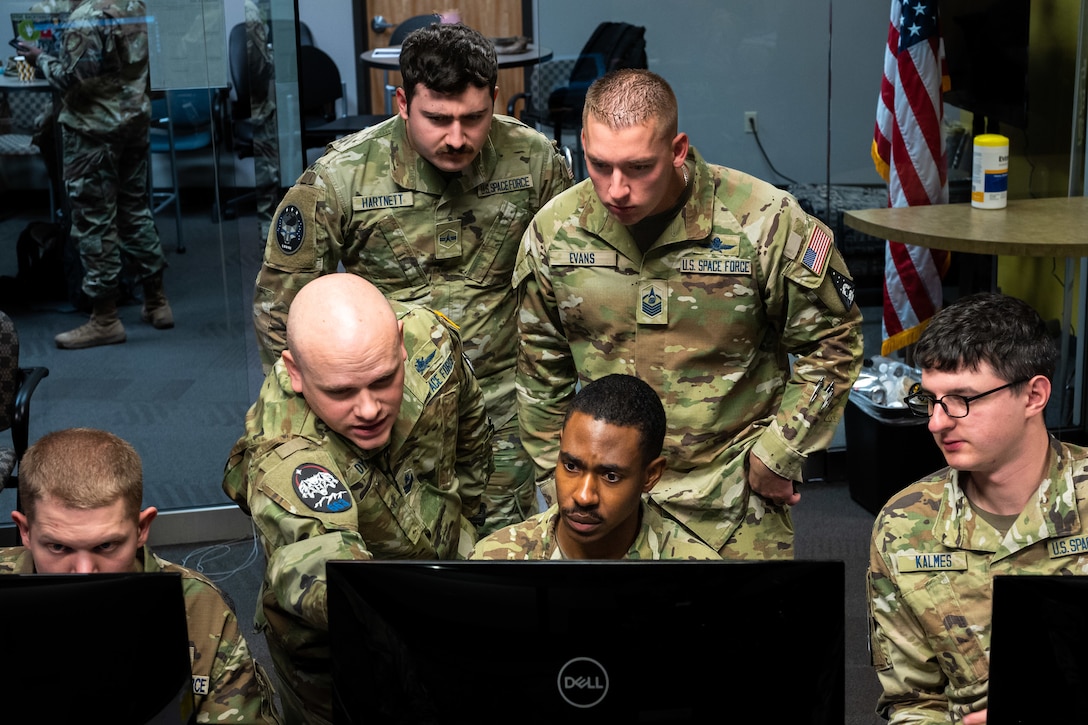 U.S. Space Force Guardians participate in Moonlighter, an exercise designed to focus on refining the defensive and offensive skill sets of these Guardians, centered around the Moonlighter imaging satellite, in Colorado Springs, Colorado, Nov. 15, 2023, The Moonlighter imaging satellite, a 3U CubeSat, serves as an exclusive on-orbit cyber test platform. Its role includes facilitating defensive cyber operations and refining cyber-related tactics, techniques, and procedures.(U.S. Space Force photo by Ethan Johnson)