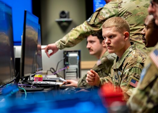  U.S. Space Force Guardians participate in Moonlighter, an exercise designed to focus on refining the defensive and offensive skill sets of Cyber Guardians, centered around the Moonlighter imaging satellite, in Colorado Springs, Colorado, Nov. 15, 2023, The Moonlighter imaging satellite, a 3U CubeSat, serves as an exclusive on-orbit cyber test platform. Its role includes facilitating defensive cyber operations and refining cyber-related tactics, techniques, and procedures.(U.S. Air Force photo by 1st Lt. Charles Rivezzo)