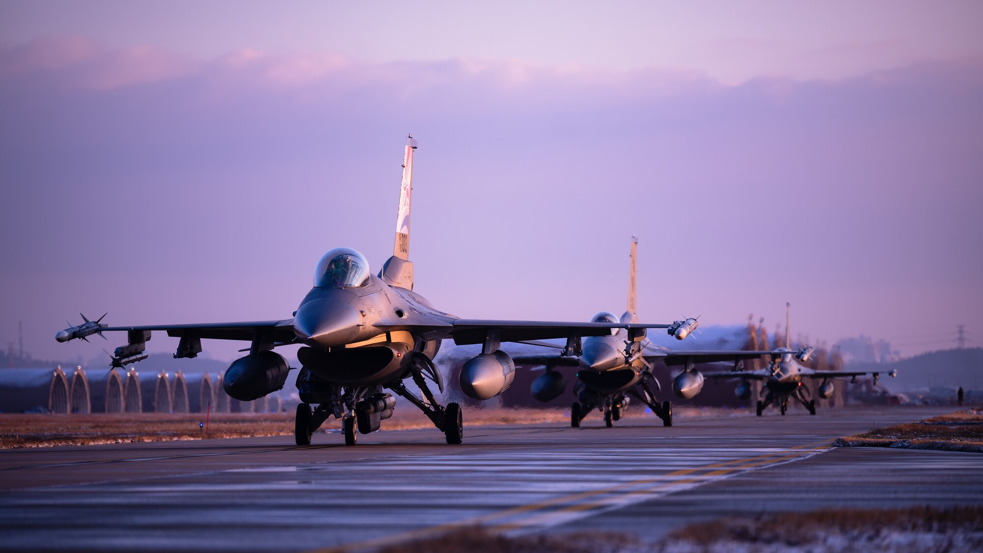 F-16 Fighting Falcons assigned to the 80th and 35th Fighter Squadrons taxi before take-off at Kunsan Air Base