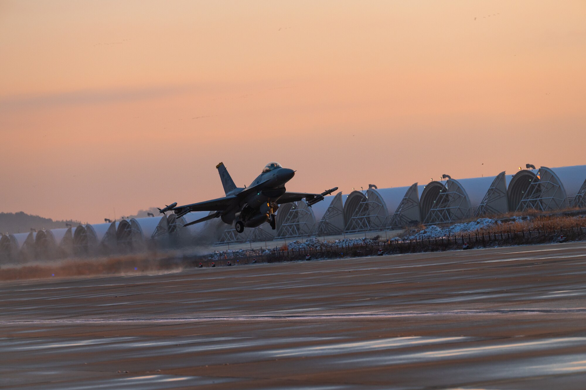 F-16 Fighting Falcon assigned to the 80th Fighter Squadron takes off from an alternate departure and landing surface at Kunsan Air Base