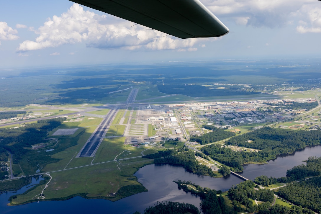 An aerial picture of Marine Corps Air Station Cherry Point (MCAS), North Carolina, taken from a KC-130J Super Hercules assigned to Marine Aerial Refueler Transport Squadron 252, 2nd Marine Aircraft Wing, July 11, 2023. Historical aerial photographs of MCAS Cherry Point are captured to showcase the development and expansion of the installation over the years. (U.S. Marine Corps photo by Lance Cpl. Lauralle Walker)