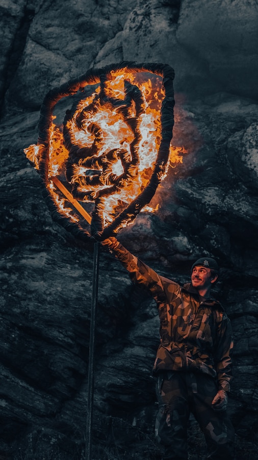 A Swedish Marine burns the Torleif, the Swedish Marines’ Regimental symbol, during a ceremonial Viking night as a part of Exercise Archipelago Endeavor 23 in Sweden on Sept. 13, 2023. Exercise Archipelago Endeavor is an integrated, Swedish Armed Forces-led exercise that increases operational capability and enhances strategic cooperation between the U.S. Marines and Swedish forces. (U.S. Marine Corps photo by Lance Cpl. Emma Gray)
