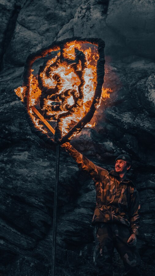 A Swedish Marine burns the Torleif, the Swedish Marines’ Regimental symbol, during a ceremonial Viking night as a part of Exercise Archipelago Endeavor 23 in Sweden on Sept. 13, 2023. Exercise Archipelago Endeavor is an integrated, Swedish Armed Forces-led exercise that increases operational capability and enhances strategic cooperation between the U.S. Marines and Swedish forces. (U.S. Marine Corps photo by Lance Cpl. Emma Gray)