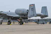 Airmen assigned to the 175th Maintenance Squadron load a simulated BDU-50 bomb onto an A-10C Thunderbolt II aircraft during an integrated combat turn as part of Operation Frosty Strike Dec. 1, 2023, at Martin State Air National Guard Base, Middle River, Md. The full-scale readiness exercise demonstrated the 175th Wing’s ability to survive and operate in a realistic combat environment against a near-peer adversary.