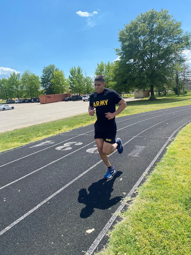 Staff Sgt. Marti runs on a track.