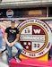 U.S. Army Reserve Staff Sgt. Francisco Marti Gonzalez, a human resources sergeant assigned to the Military Intelligence Readiness Command, stands next to a Washington Commanders logo at FedEx Field Oct. 5, 2023, North Englewood, Md. The Washington Commanders organization honored cancer survivors with military ties during a home game. (Photo courtesy of Staff Sgt. Francisco Marti Gonzalez)