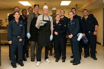 231122-N-XB532-1012 NEWPORT NEWS, Va. (Nov. 22, 2023) - Celebrity Drew Allison Carey poses for a photo with Sailors assigned to the Nimitz-class aircraft carrier USS John C. Stennis (CVN 74), during a tour of Stennis, in Newport News, Virginia, Nov. 22, 2023. John C. Stennis is in Newport News Shipbuilding conducting Refueling and Complex Overhaul to prepare the ship for the second half of its 50-year service life. (U.S. Navy photo by Mass Communication Specialist Seaman Najwa Ziadi)