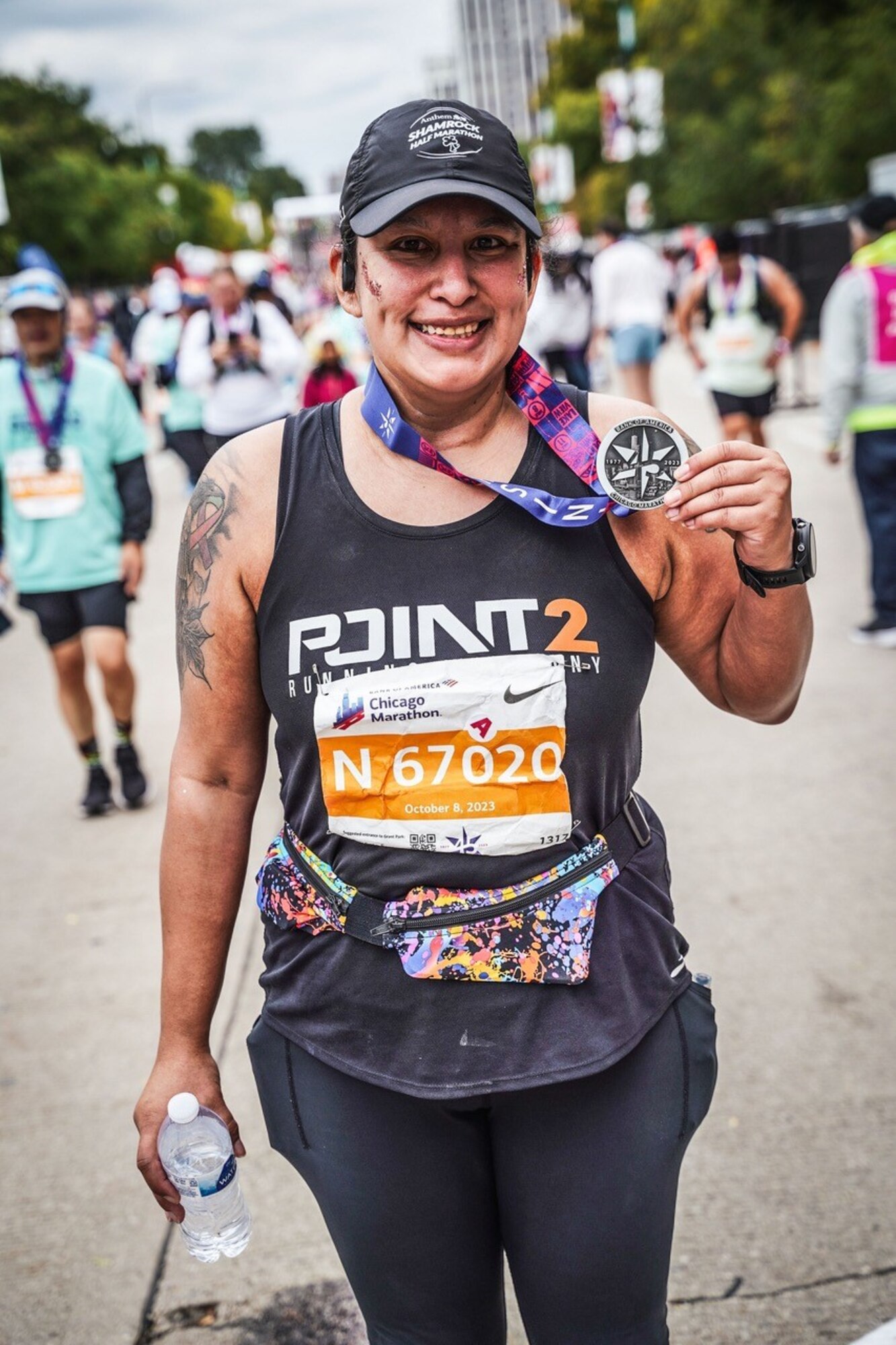 U.S. Air Force Tech. Sgt. Cindy Mascrier, 441st Vehicle Support Chain Operations Squadron program manager, holds a medal after completing a marathon, Oct. 8, 2023, Chicago, Ill. After being diagnosed with thyroid cancer in 2008, Mascrier has beat her illness and is now in remission. She continues to stay resilient while participating in physically demanding activities. (Courtesy photo)