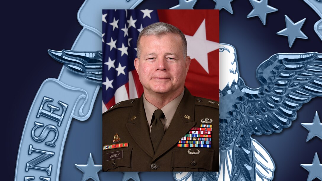 Head and shoulders picture of a man in a green uniform with medals on his left shoulder.