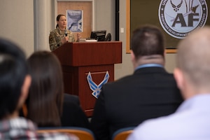 Colonel congratulates graduate.