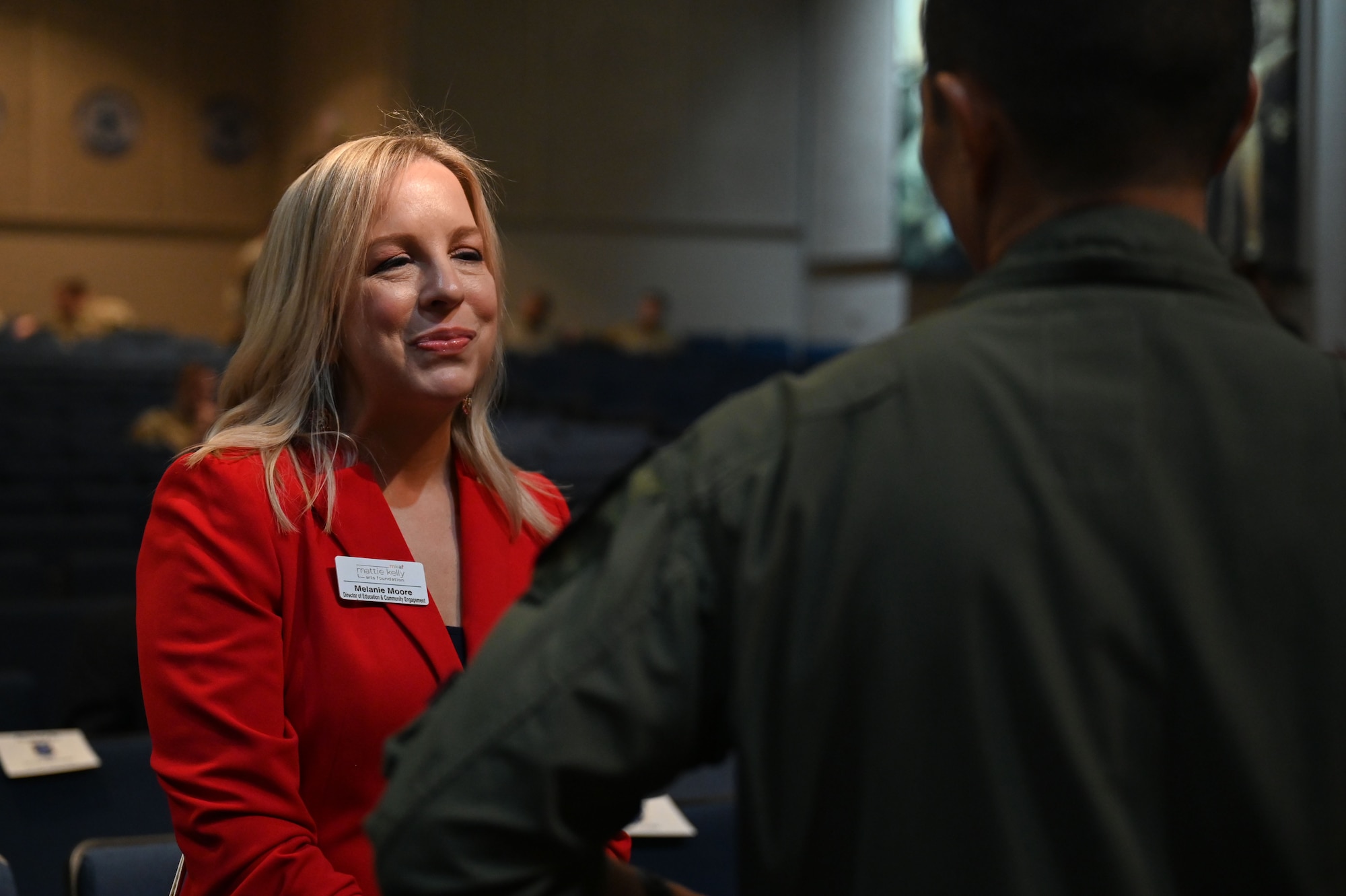 Melanie Moore, director of education and community engagement for the Mattie Kelly Arts Foundation, talks to U.S. Air Force Lt. Col. Chad Nishizuka, 16th Electronic Warfare Squadron commander, before the 350th Spectrum Warfare Wing’s first Honorary Commander induction ceremony, at Eglin Air Force Base, Fla., Dec. 1, 2023. The mission of the 350th Spectrum Warfare Wing Honorary Commanders Program is to educate key community leaders about a unit’s mission and to foster a supportive relationship with the community, while also increasing military involvement in civic endeavors and organizations. (U.S. Air Force photo by Staff Sgt. Ericka A. Woolever)