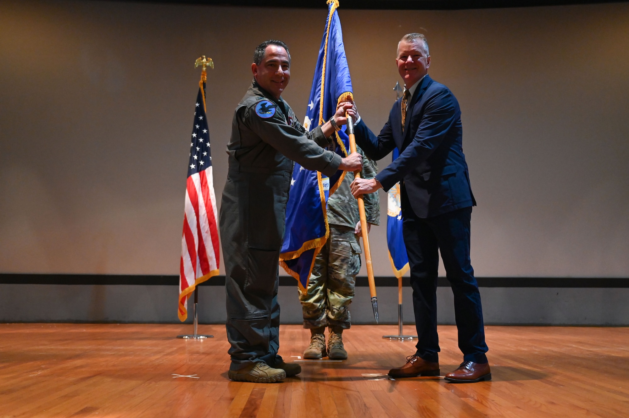 U.S. Air Force Col. Josh Koslov, 350th Spectrum Warfare wing commander, inducts Tim Mccool, co-founder and co-owner of 3rd Planet Brewery in Niceville and member of the Niceville Chamber of Commerce and the Northwest Florida State College Foundation Board, during the wing’s first Honorary Commander Induction ceremony, at Eglin Air Force Base, Fla., Dec. 1, 2023. Honorary Commanders serve as the liaison between the 350th SWW and the surrounding community by maintaining strong relations through mutually beneficial professional partnership. (U.S. Air Force photo by Staff Sgt. Ericka A. Woolever)