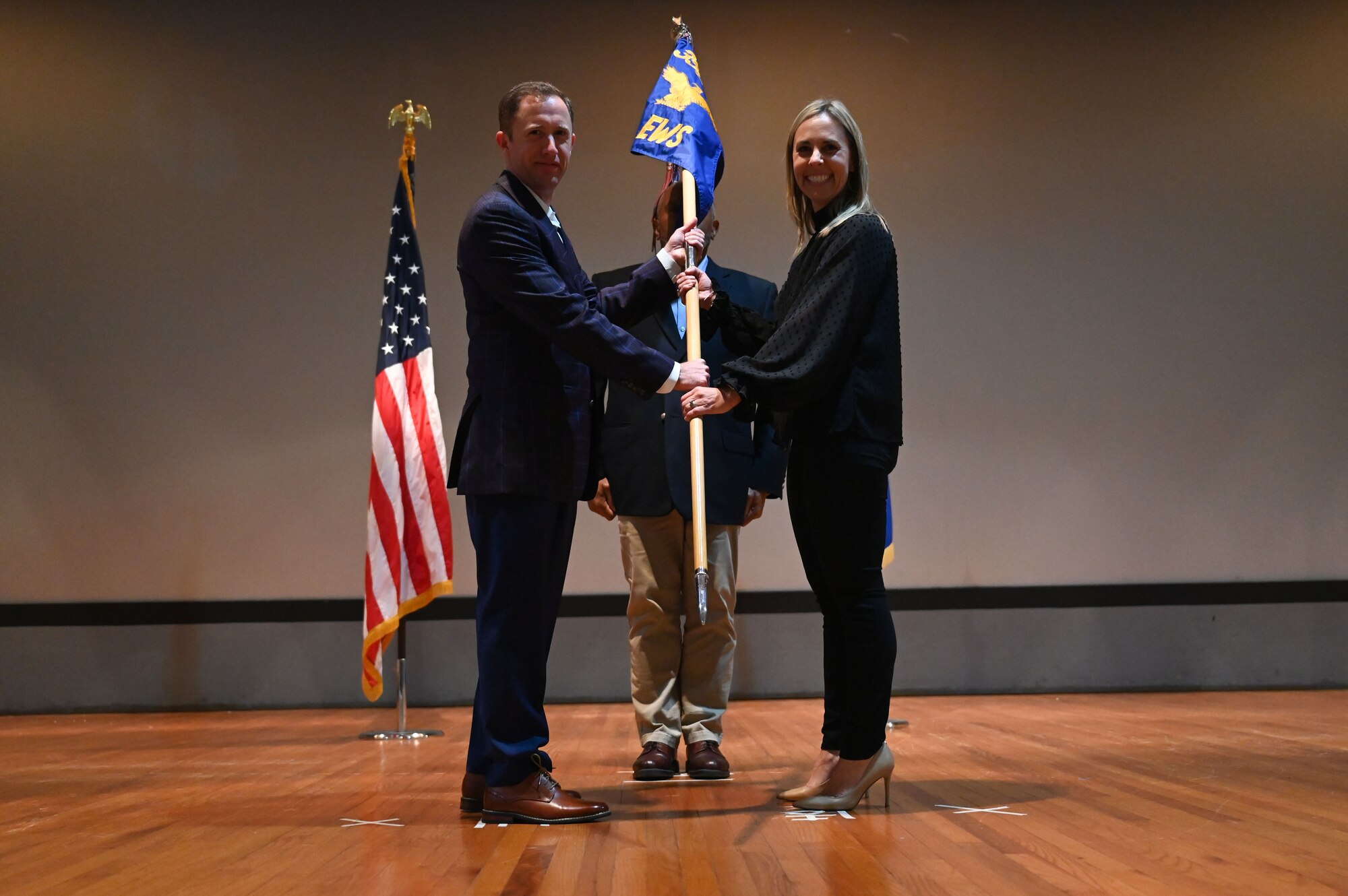 Justin Goldstein, 68th Electronic Warfare Squadron director, inducts Emily Probst, the owner and partner of the Probst George Group, Exp Realty, member of the Women’s Counsel of Relators and is a Mission of Hope Ambassador, during the wing’s first Honorary Commander Induction ceremony, at Eglin Air Force Base, Fla., Dec. 1, 2023. Honorary Commanders serve as the liaison between the 350th Spectrum Warfare Wing and the surrounding community by maintaining strong relations through mutually beneficial professional partnership. (U.S. Air Force photo by Staff Sgt. Ericka A. Woolever)