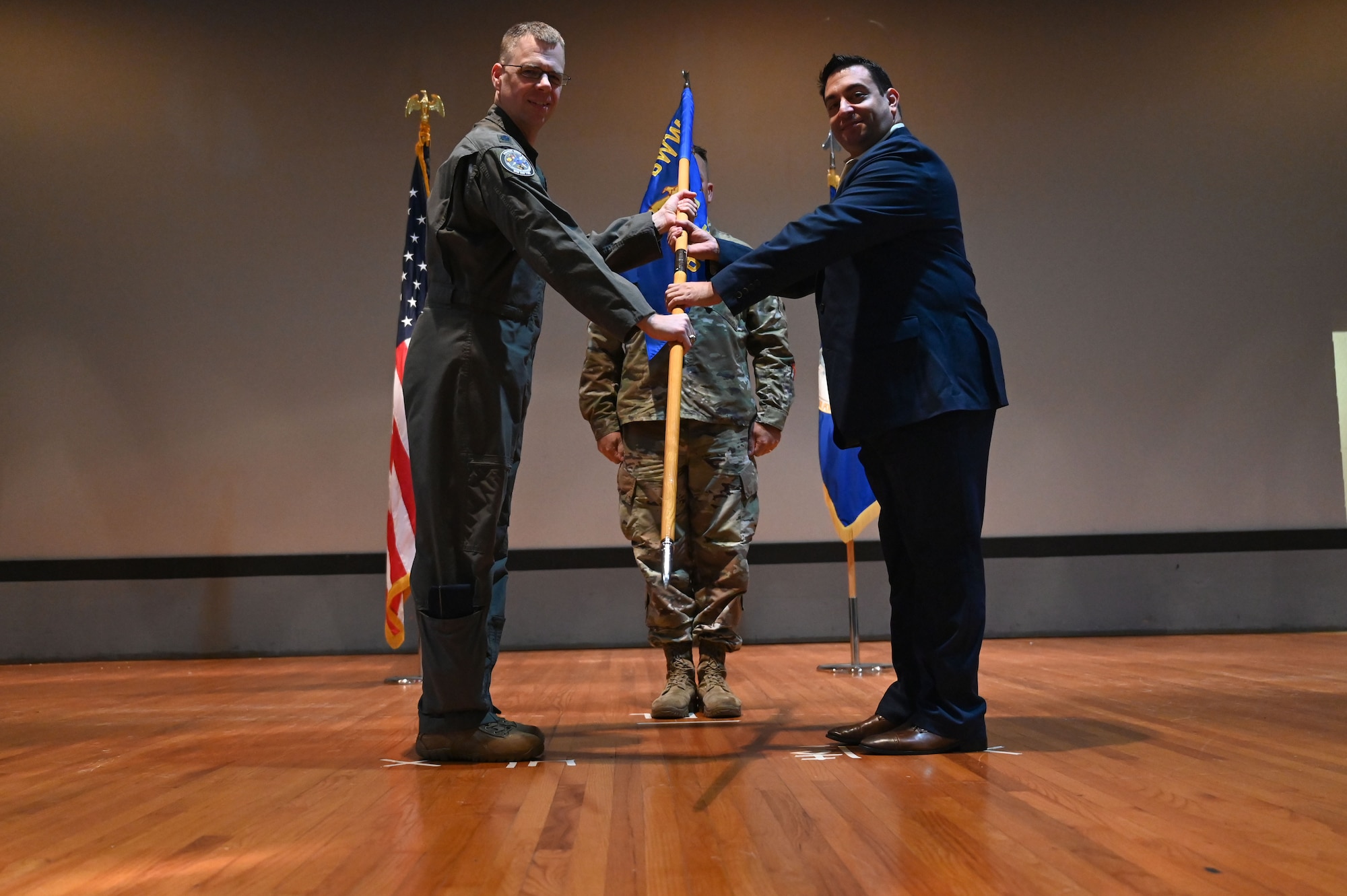 U.S. Air Force Lt. Col. Matthew Munska, 850th Spectrum Warfare Group deputy commander, inducts Matthew Pace, Senior Director of Enterprise It and Security at Merlyn Mind and serves on the Destin Military Affairs Committee, during the wing’s first Honorary Commander Induction ceremony, at Eglin Air Force Base, Fla., Dec. 1, 2023. Honorary Commanders serve as the liaison between the 350th Spectrum Warfare Wing and the surrounding community by maintaining strong relations through mutually beneficial professional partnership. (U.S. Air Force photo by Staff Sgt. Ericka A. Woolever)