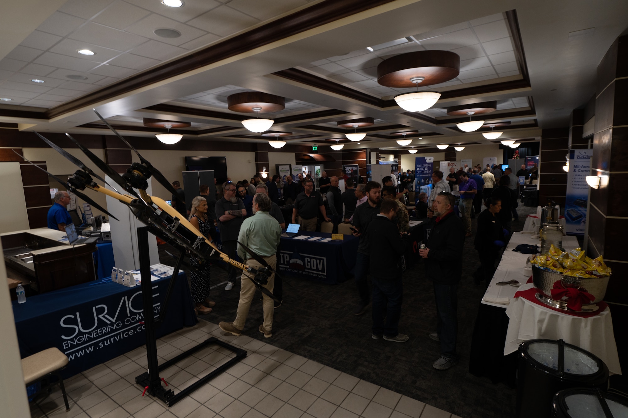 Service members and technology industry professionals discuss new innovations during a tech expo at MacDill Air Force Base, Florida, Dec 5, 2023.