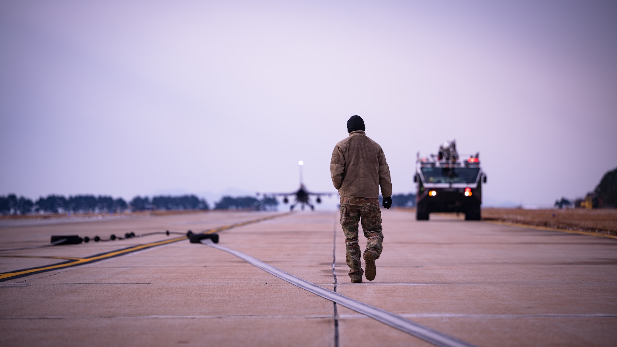 An Airman assigned to 8th Maintenance Squadron retrieves an arresting cable following a certification test at Kunsan Air Base