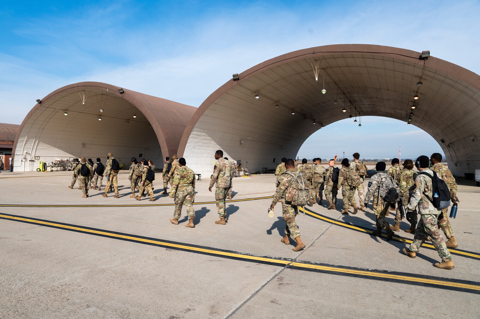 U.S. Army Soldiers, 2nd Infantry Division Sustainment Brigade, walk to a hot-pit refueling hanger to train with the 51st Logistics Readiness Squadron fuels flight at Osan Air Base, Republic of Korea, Nov. 29, 2023.