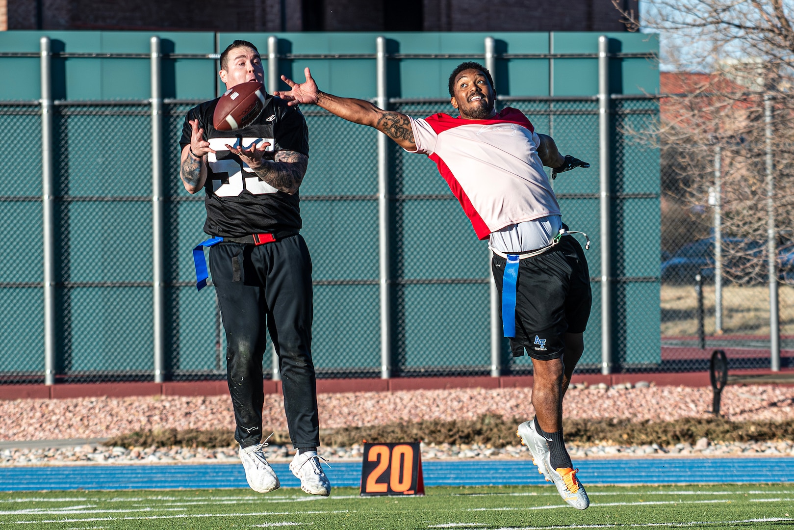 Man jumping for football