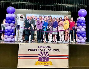 Luke Air Force Base leadership, along with Millennium High School staff and local community partners, pose for a photo during a Purple Star candidate ribbon cutting ceremony Nov. 20, 2023 in Phoenix, Arizona.