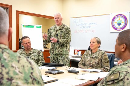 Joint Task Force-Red Hill (JTF-RH) Commander, U.S. Navy Vice Adm. John Wade, delivers remarks during a planning meeting between JTF-RH staff and members of the Navy Closure Task Force-Red Hill (NCTF-RH) at Joint Base Pearl Harbor-Hickam, Hawaii, Nov. 28, 2023.