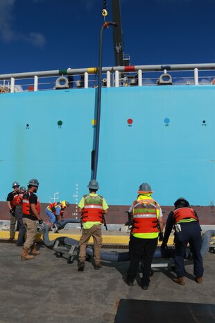 Personnel in support of Joint Task Force-Red Hill (JTF-RH) connect a fuel line to merchant tanker Yosemite Trader, initiating the ninth transfer of fuel from the Red Hill Bulk Fuel Storage Facility (RHBFSF) at Joint Base Pearl Harbor-Hickam, Hawaii, Dec. 4, 2023.